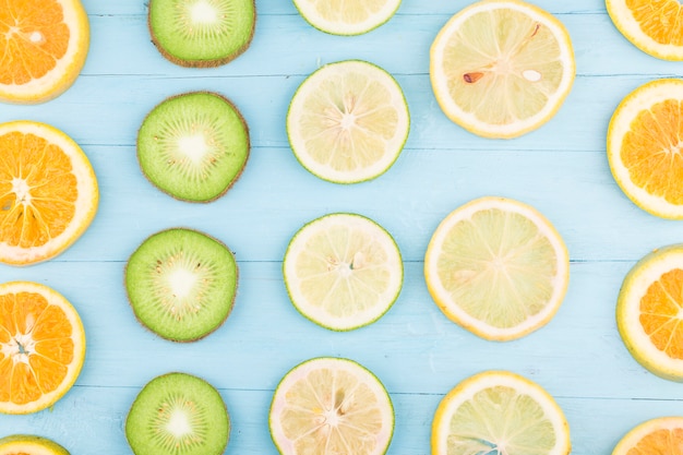 Fruit background. Colorful fresh fruit on Blue wooden board.