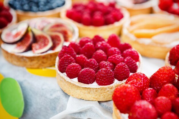 Fruit and berry tarts on a table