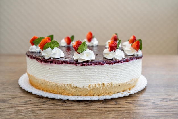 Fruit cake with marmalade and whipped cream