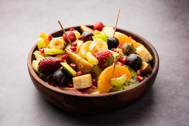 Fruit Chaat is a tangy Indian dish made by combining chilled juicy fruits like apples, bananas, oranges, grapes with salt and mild spices