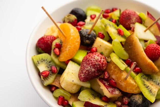 Fruit Chaat is a tangy Indian dish made by combining chilled juicy fruits like apples, bananas, oranges, grapes with salt and mild spices