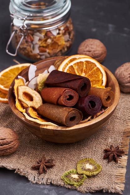 Fruit pastille and dried fruits in wooden cup