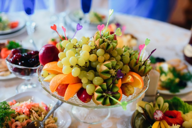 Fruit plate with fresh orange, grapes, kiwi and Apple