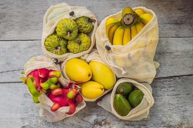 Fruit in a reusable bag on a stylish wooden kitchen surface zero waste concept plastic free concept