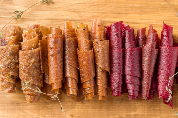 Fruit rolls on wooden board