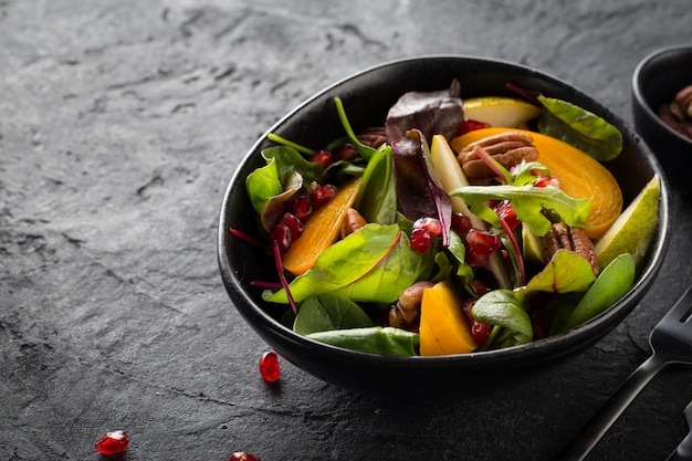 Fruit salad in a black bowl