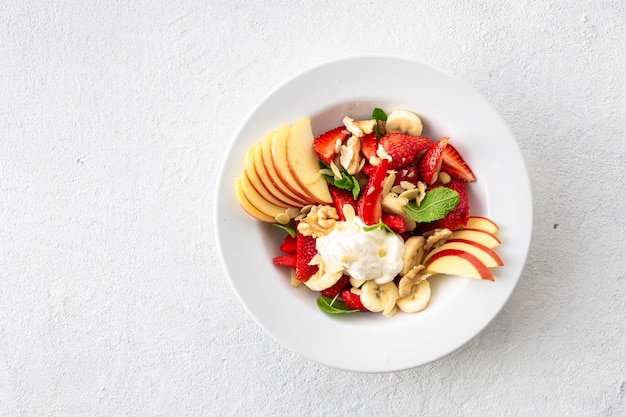 Fruit salad bowl. Healthy summer food