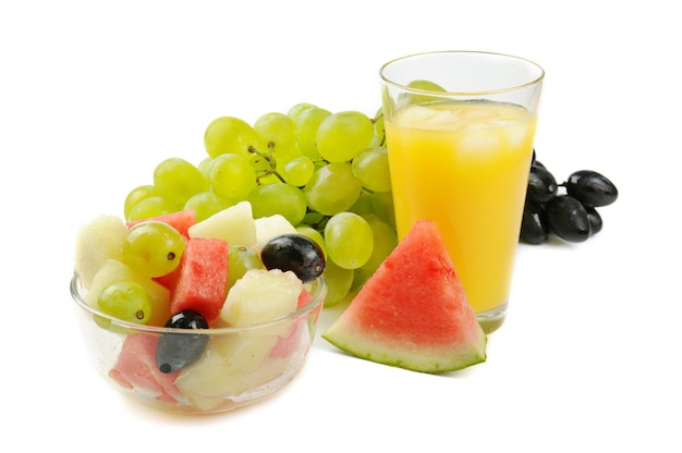 Fruit salad with orange juice isolated on white