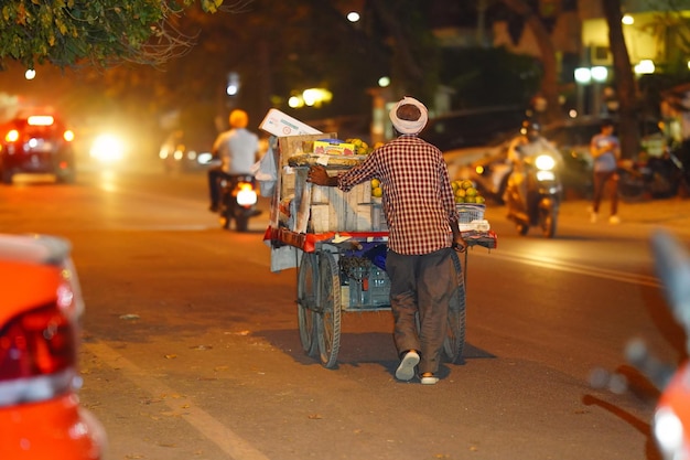 Fruit seller images poor indian man in night alone