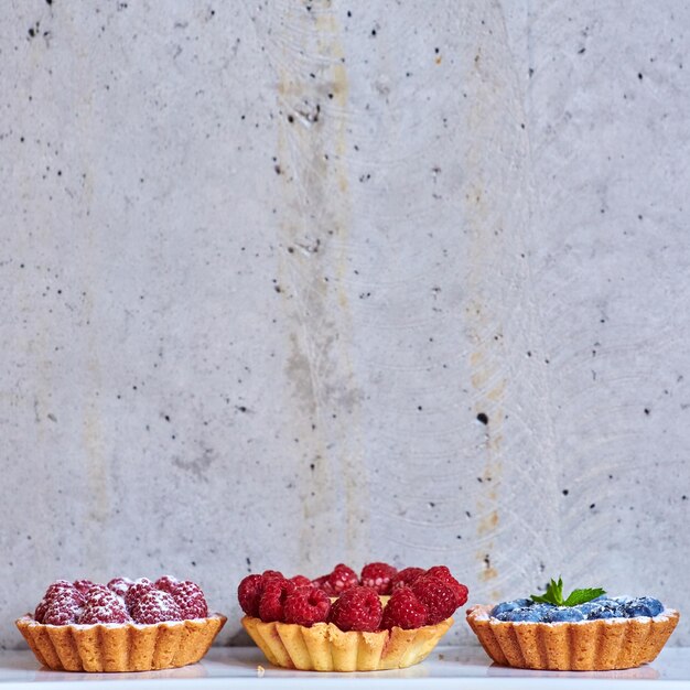 Fruit tartlets with raspberries and blueberries