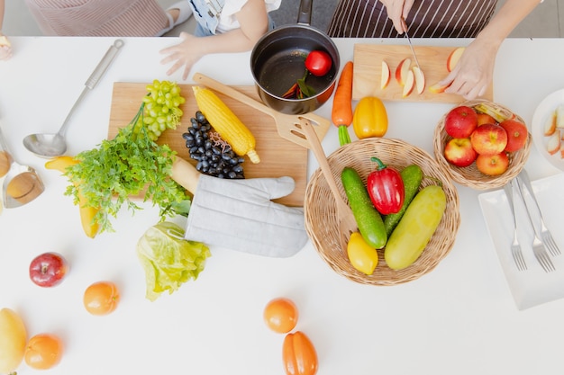 Fruit and vegetable mix decoration at kitchen table top view