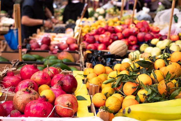 Fruit and vegetable stall in a street market in Naples in Italy Signs with prices in the background