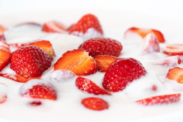 Fruit yogurt and red strawberries.