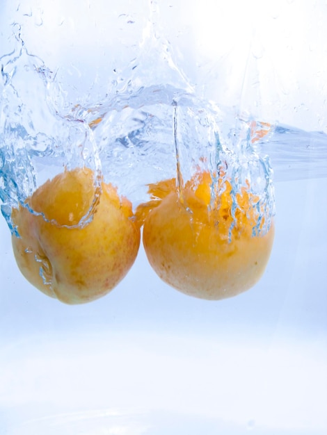 Fruits falling into the water