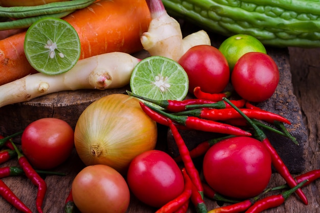 Fruits and mixed vegetables on old wooden table