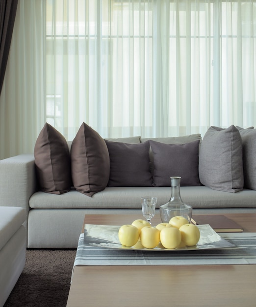 Fruits on tray with beige sofa in the living room