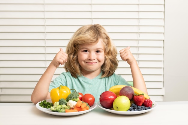 Fruits and vegetables Funny kid boy having breakfast Milk vegetables and fruits healthy food nutrition for children