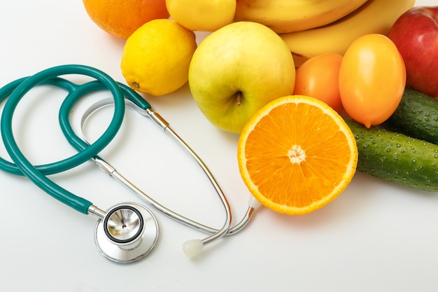 Fruits, vegetables, juice and stethoscope