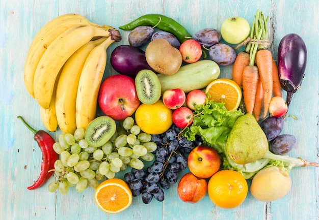 Fruits and vegetables on an old table painted blue