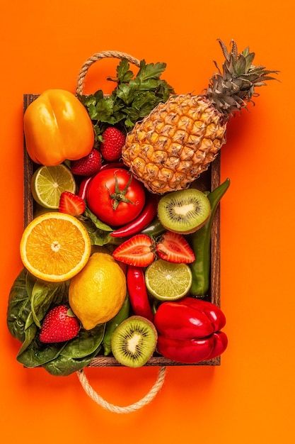 Fruits and vegetables rich in vitamin C in box. Healthy eating. Top view