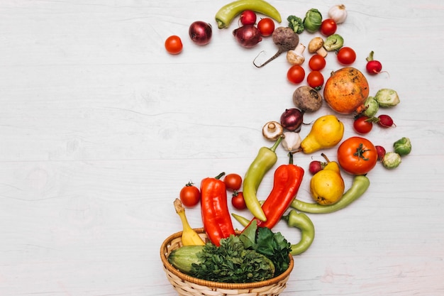 Fruits and vegetables spilled from bowl