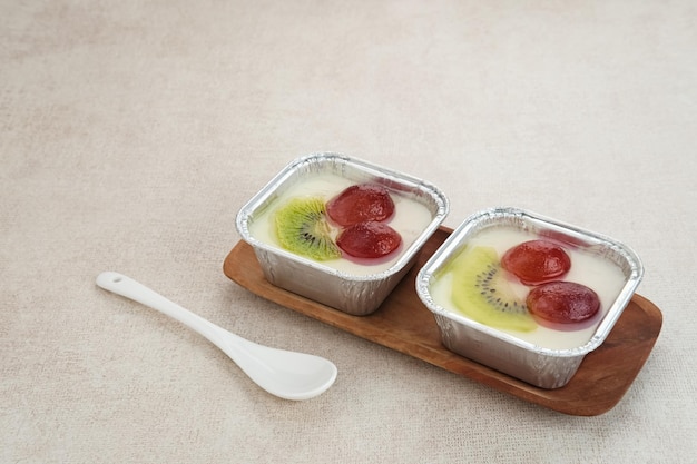 Fruity Milk Pudding, sweet vanilla silk pudding dessert with grape and kiwi fruit topping