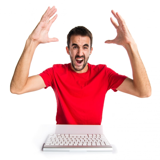 Frustrated computer technician working with his keyboard