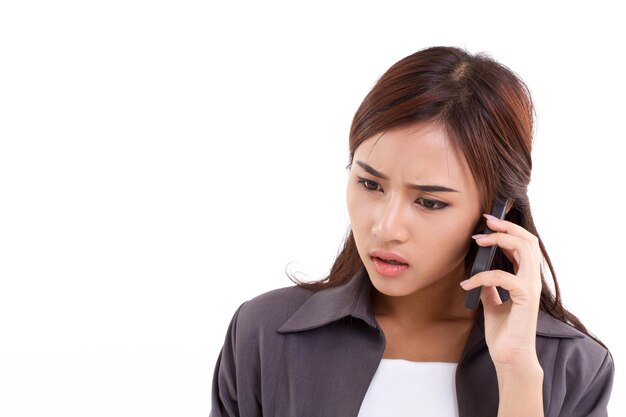 Frustrated upset disappointed business woman talking communicating via her smartphone