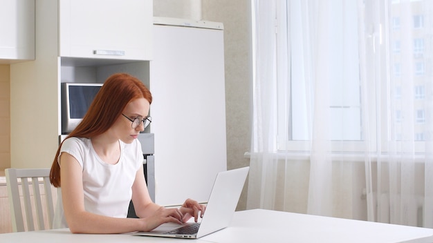 Frustrated woman working from home on her computer