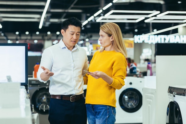 Frustrated young diverse family of shoppers man and woman not having enough money on credit bank