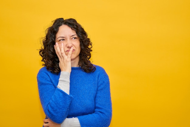 Frustrated young woman her head with one hand