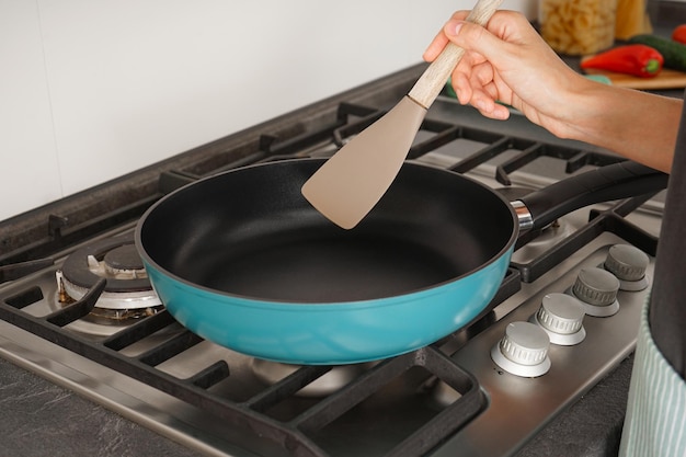 Frying pan on a gas stove closeup Preparing to cook in the kitchen