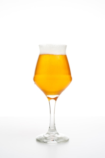 Full beer glass of pale lager of pils on white background