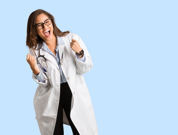 Full body young doctor woman surprised and shocked