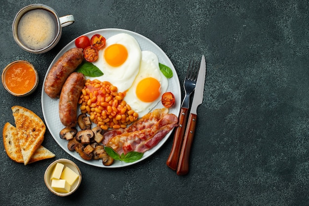 Full English breakfast on a plate with fried eggs