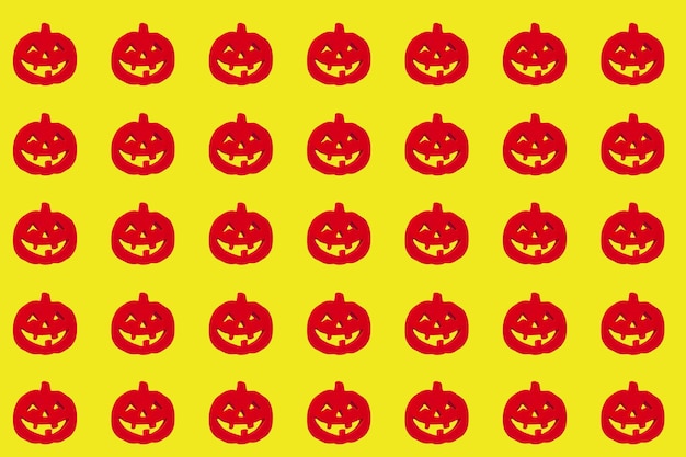 Photo full frame shot of red jack o lanterns on yellow background