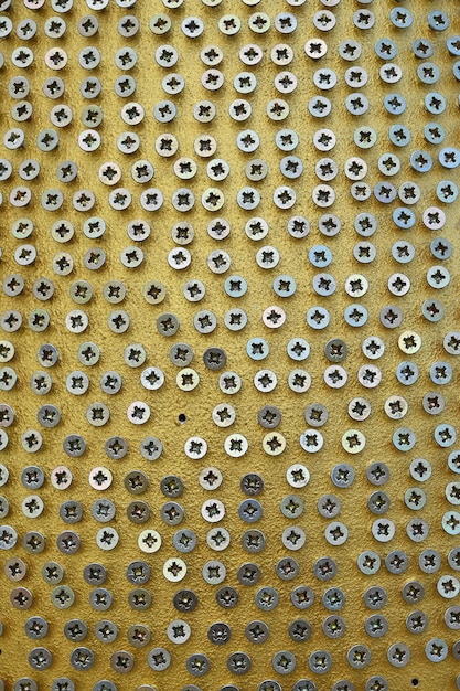 Photo full frame shot of screw art on structure