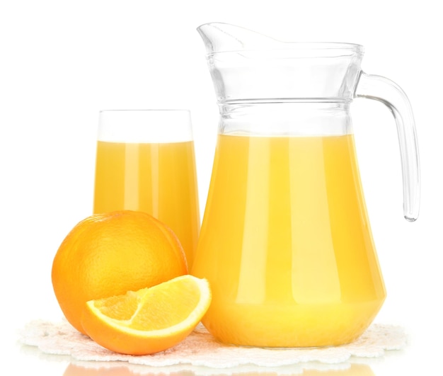 Full glass and jug of orange juice and oranges isolated on white