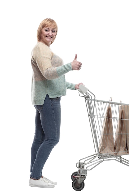 In full growth attractive casual woman with shopping cart