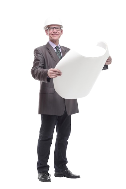 In full growth. business man in a protective helmet with drawings. isolated on a white background.