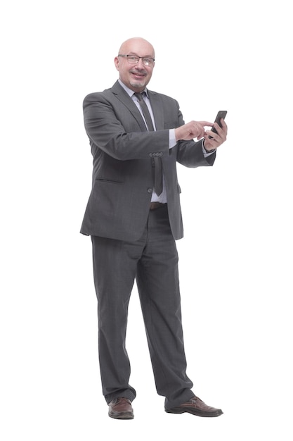 In full growth. business man with a smartphone.