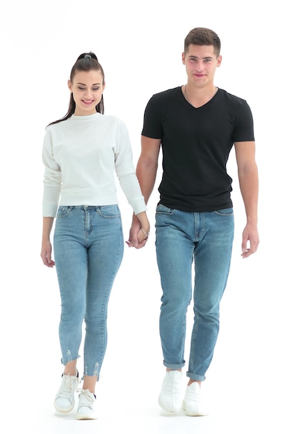 In full growth casual young couple walking together