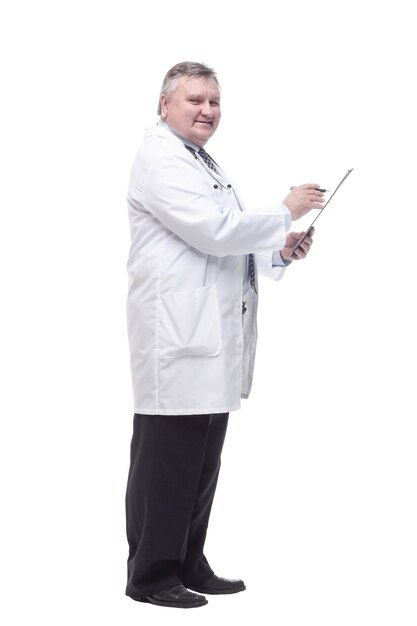 In full growth.competent doctor with clipboard. isolated on a white background.