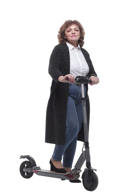 In full growth confident adult woman with an electric scooter