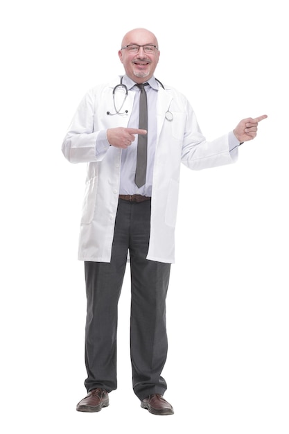 In full growth. confident mature doctor pointing the right direction .isolated on a white background