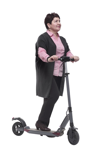 In full growth confident mature woman with an electric scooter