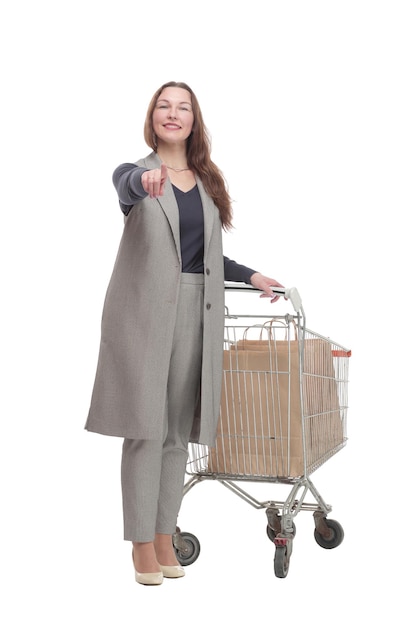 In full growth. elegant woman with a shopping cart.