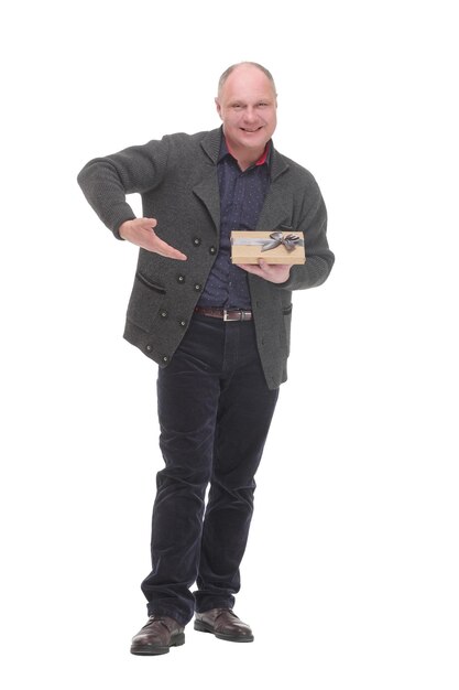 In full growth. happy mature man with gift box .isolated on a white background.