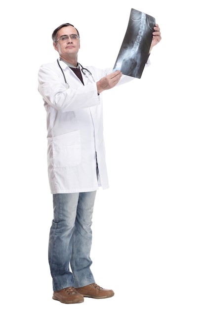 In full growth qualified doctor looking at an xray