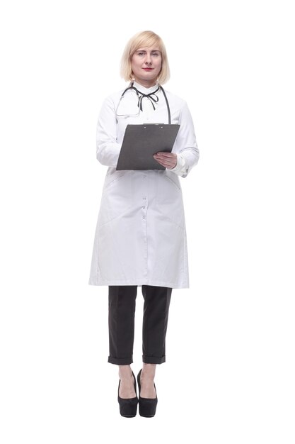 In full growth.qualified female doctor with clipboard.